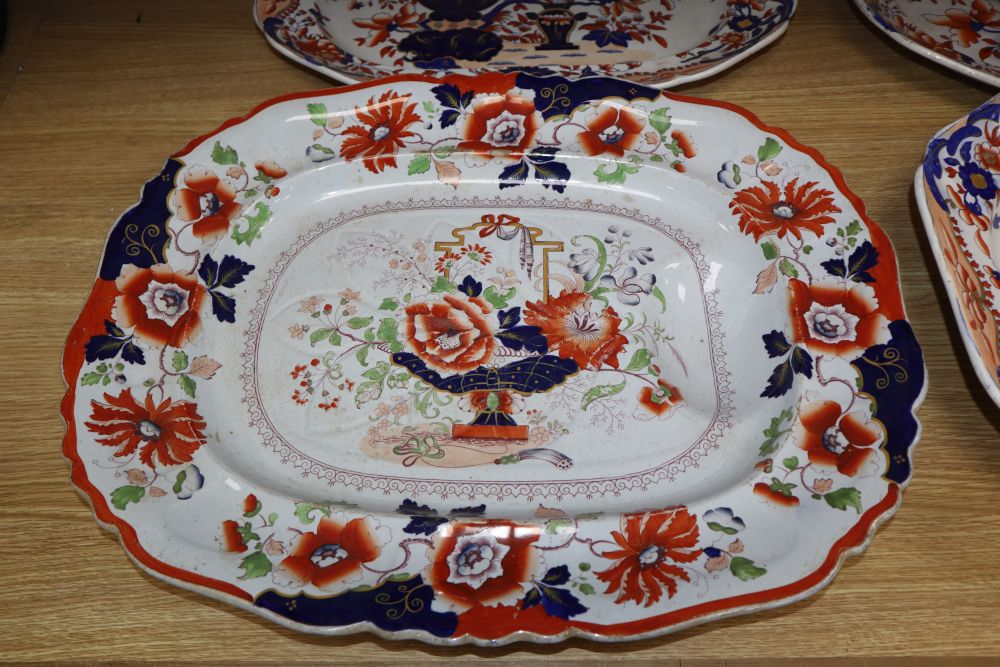 Three graduated Copeland and Garrett meat platters and an ironstone meat platter, widest 53cm